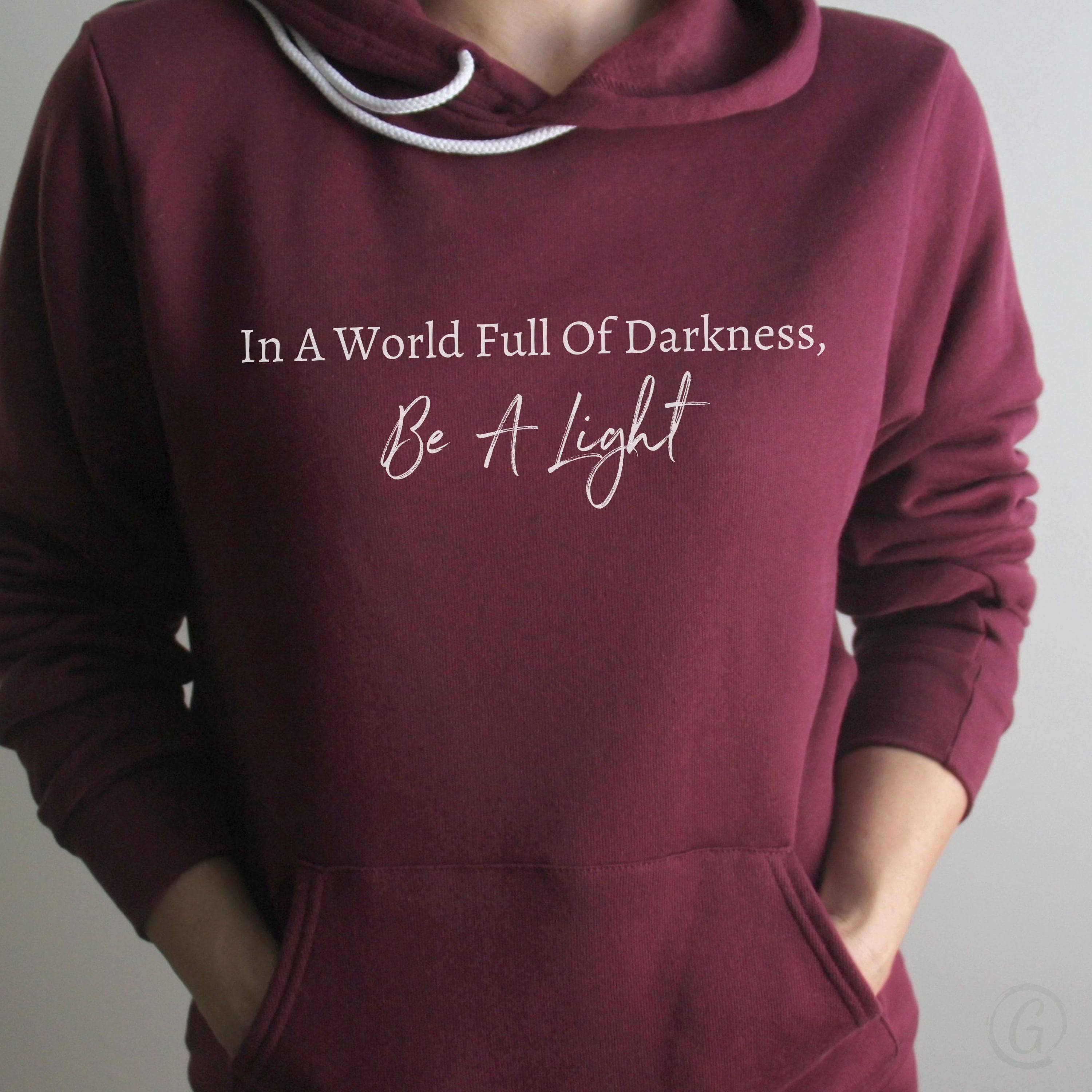 In A World Full Of Darkness, Be A Light Premium Unisex Pullover Hoodie Maroon
