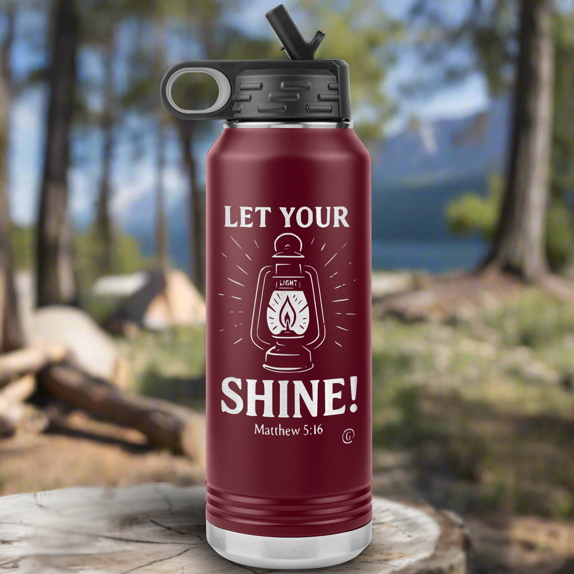 A navy-colored insulated water bottle with a quote &