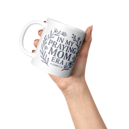 In_My_Praying_Mom_Era_11oz_Mug_Lifestyle_Raised_Hand_LH_Mockup.png