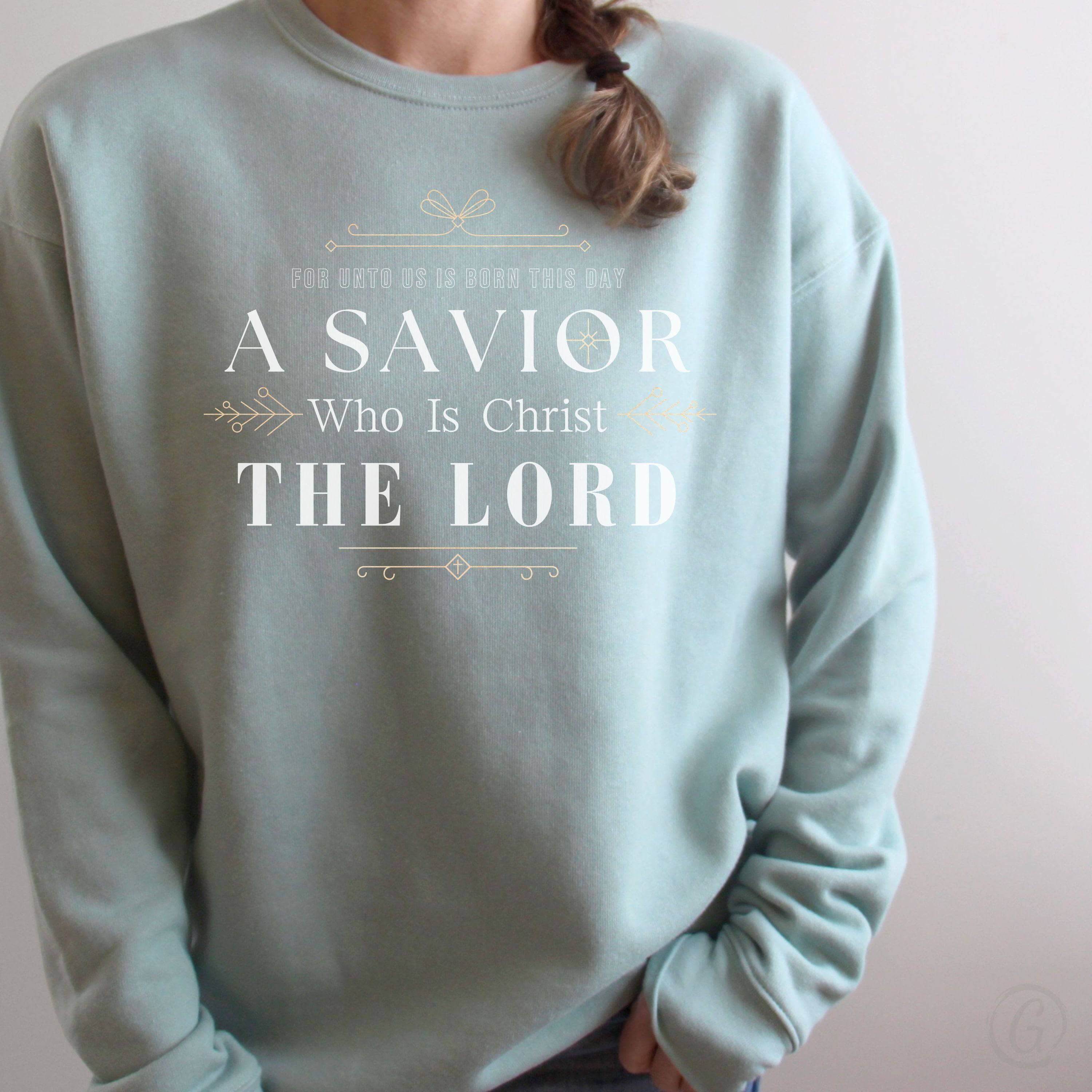 For Unto Us Is Born This Day A Savior Who Is Christ The Lord Premium Unisex Sweatshirt Dusty Blue